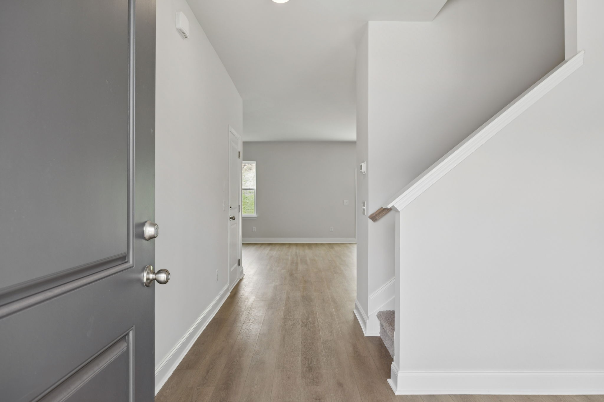 228 Limestone Way Lebanon, TN 37087 - Photo 5 of 45 a view of a hallway with wooden floor and entryway