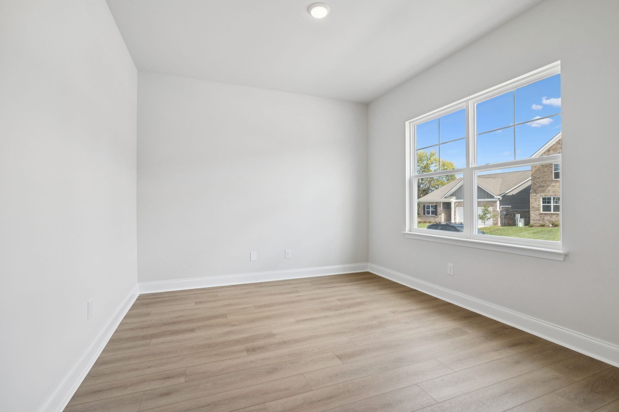 228 Limestone Way Lebanon, TN 37087 - Photo 7 of 45 wooden floor in an empty room with a window