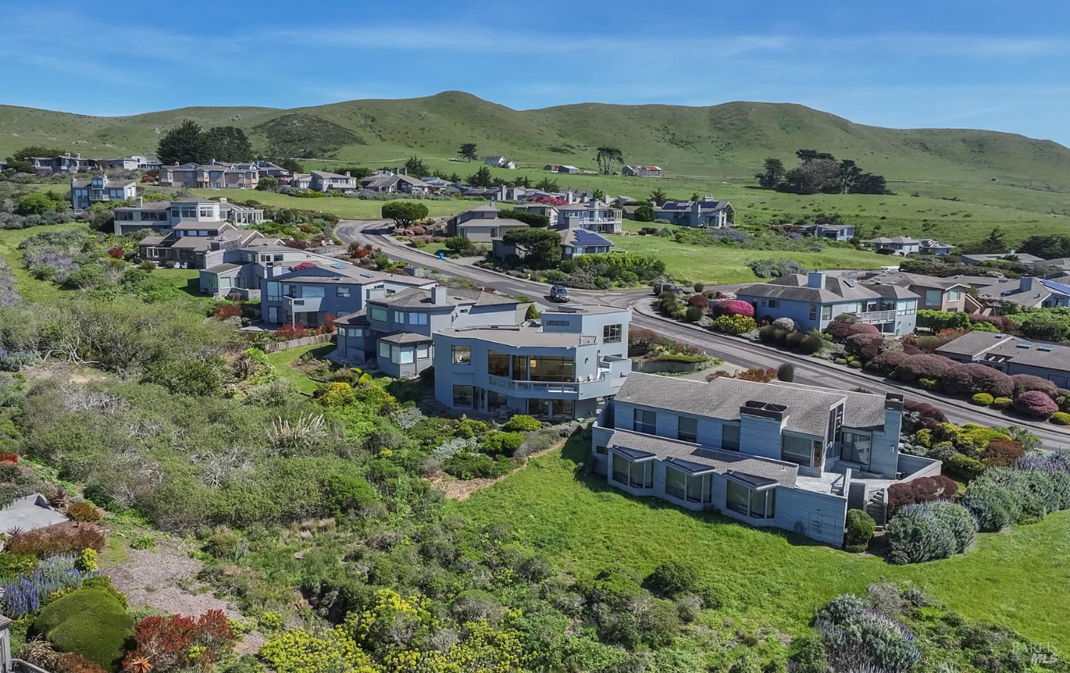 20007 Oyster Catcher Loop Bodega Bay, CA 94923 - Photo 84 of 85 a view of a lush green hillside and houses