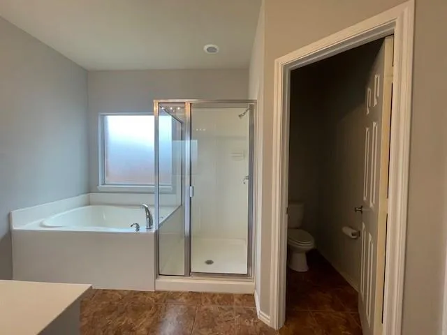 a bathroom with a tub and a sink