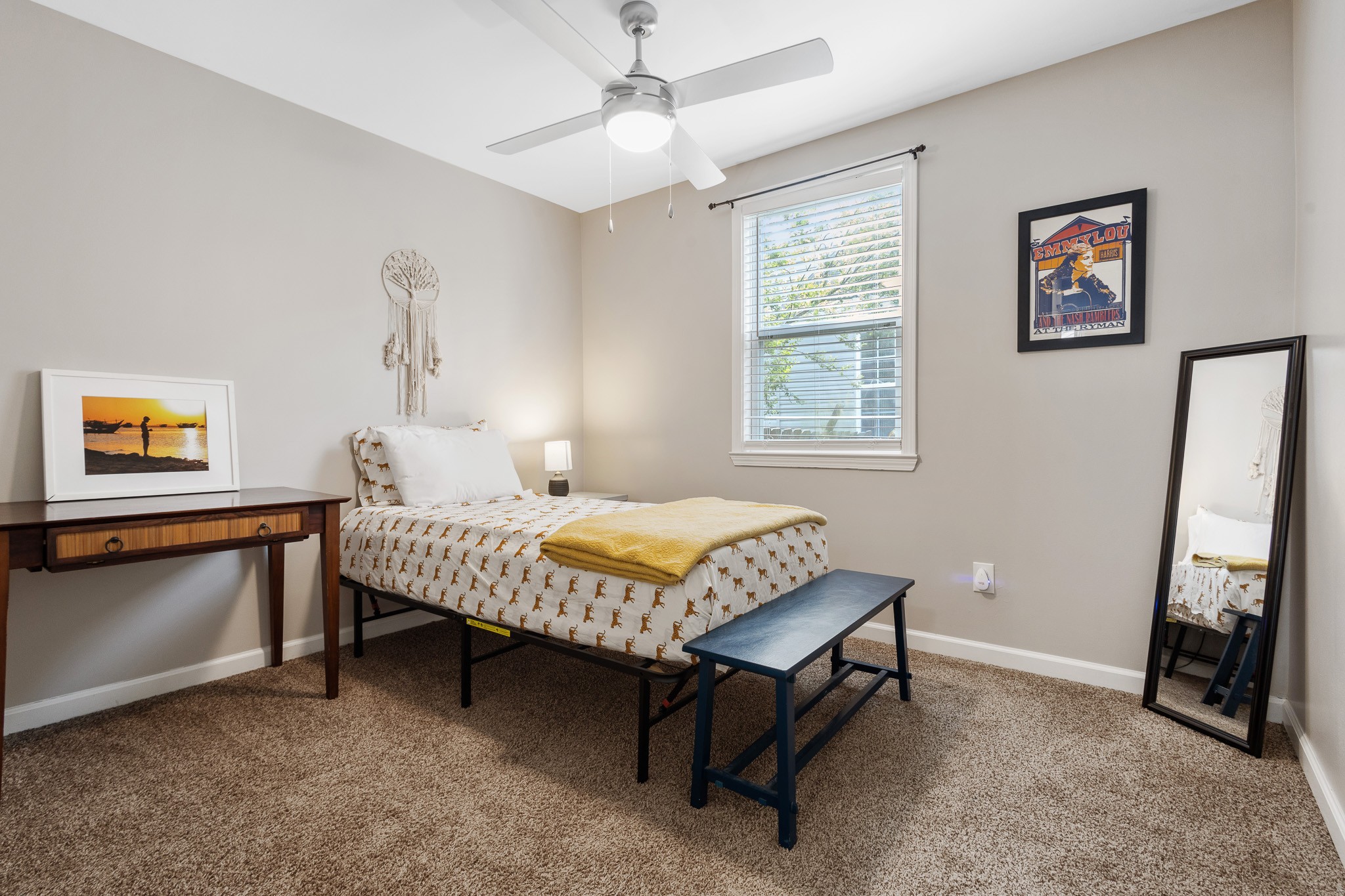 404 Elm Street Madison, TN 37115 - Photo 14 of 28 a bedroom with a bed and a dresser next to a window