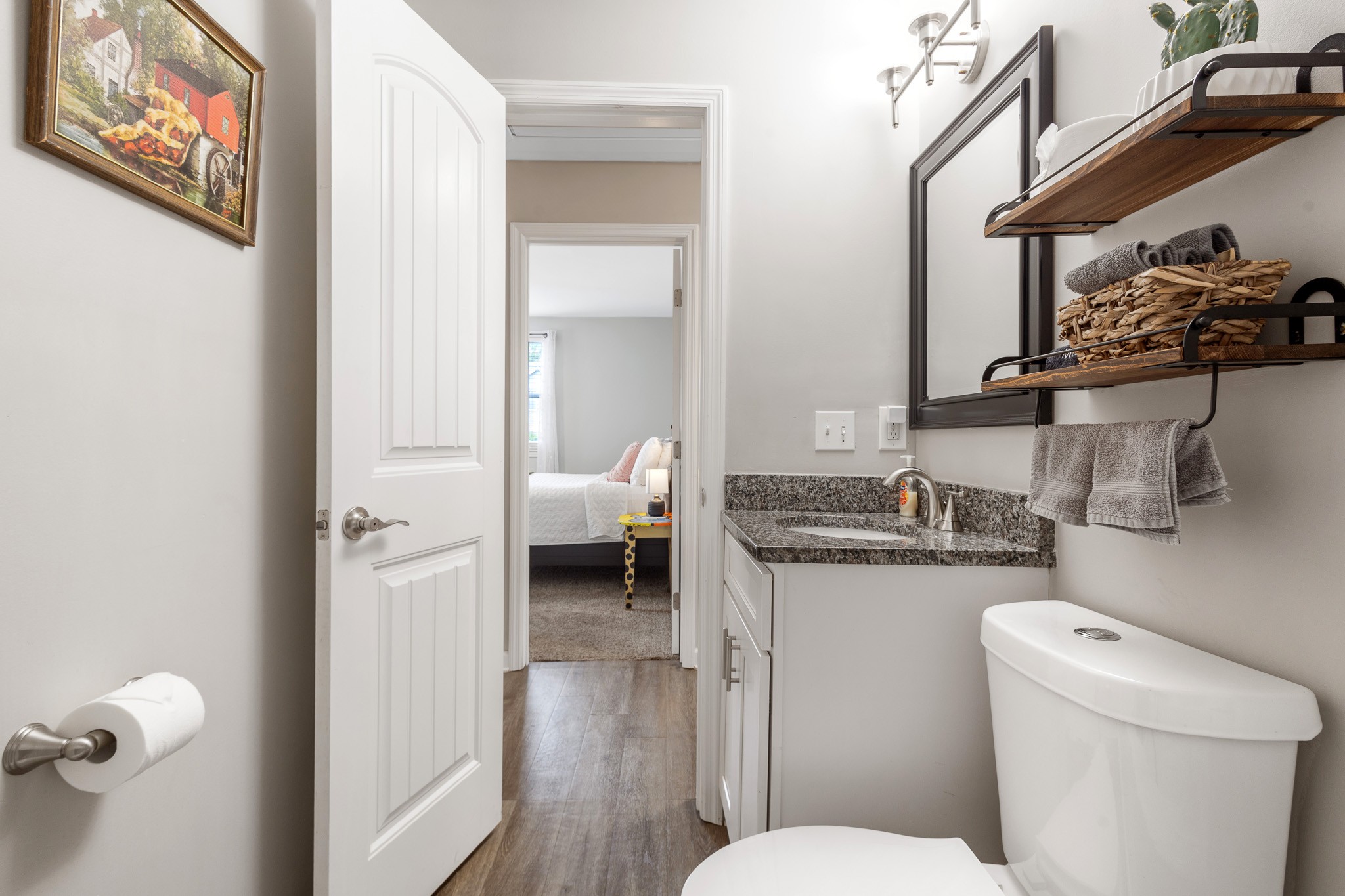 404 Elm Street Madison, TN 37115 - Photo 17 of 28 a bathroom with a granite countertop toilet sink and mirror