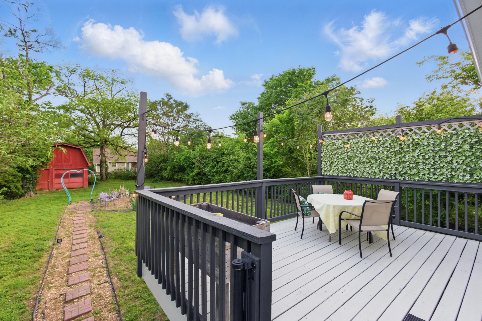 404 Elm Street Madison, TN 37115 - Photo 21 of 28 a balcony with wooden floor table and chairs