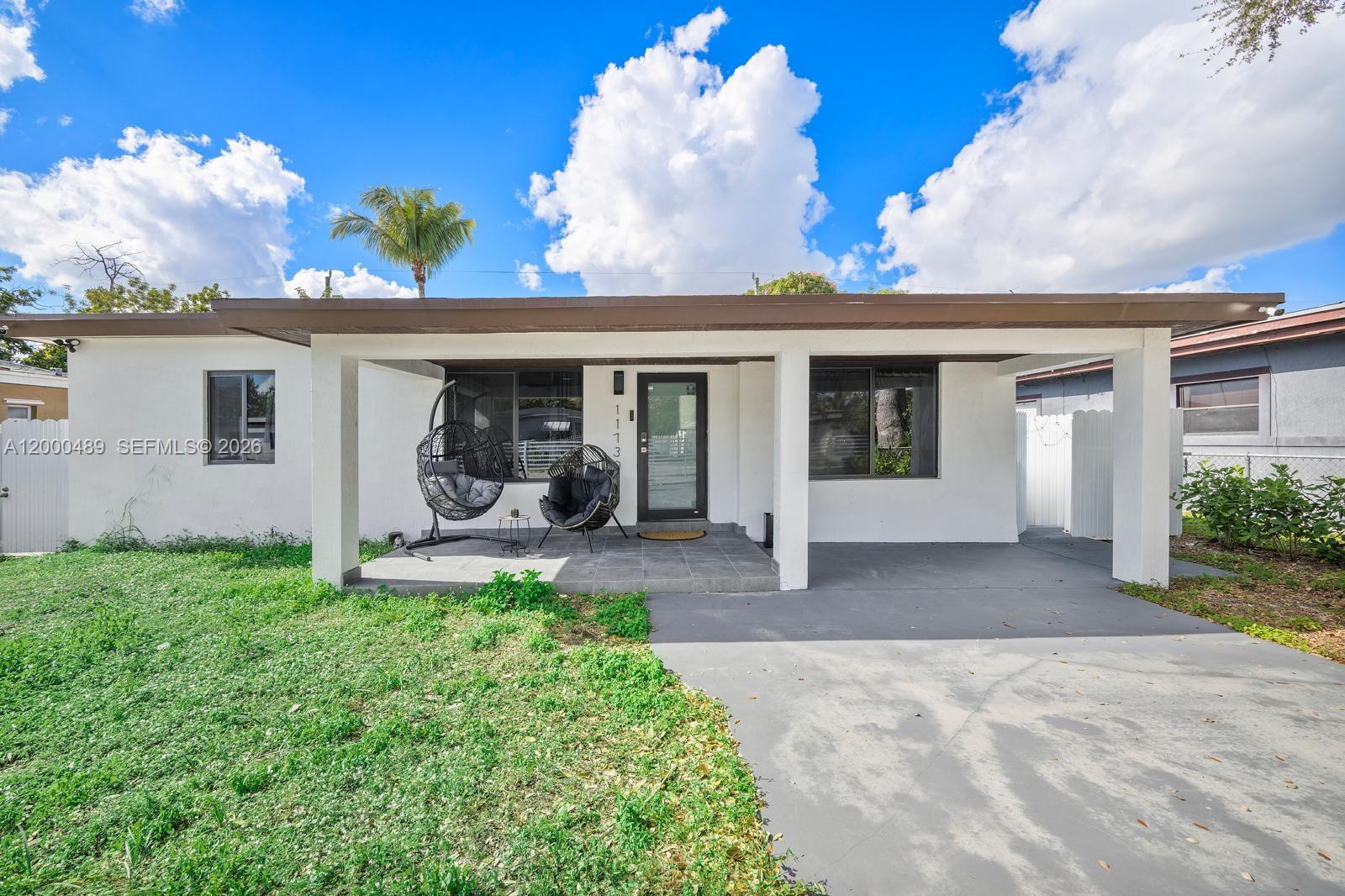 11730 Northwest 3rd Avenue Miami, FL 33168 - Photo 1 of 39 a view of a house with patio