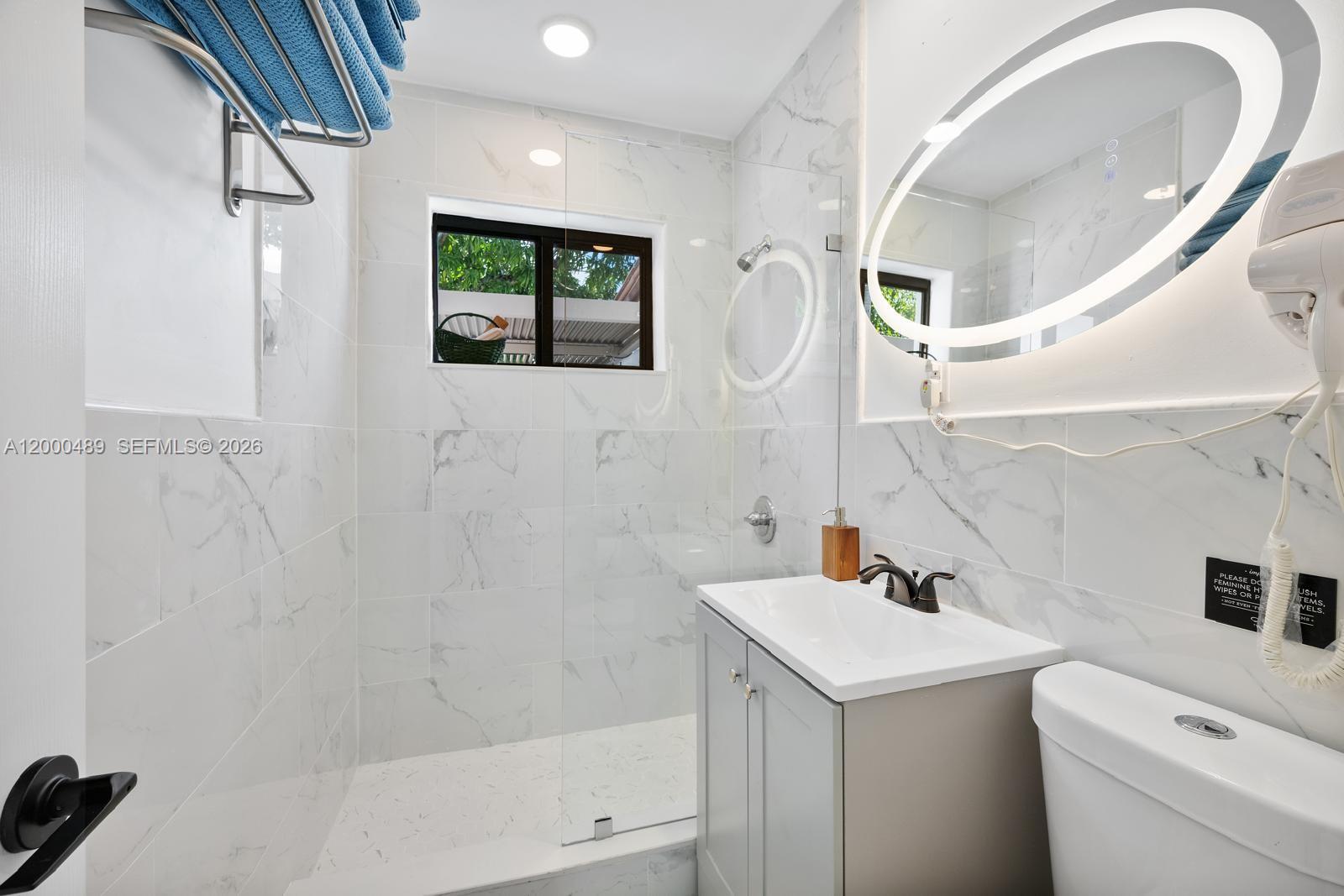 11730 Northwest 3rd Avenue Miami, FL 33168 - Photo 20 of 39 a bathroom with a sink and a mirror