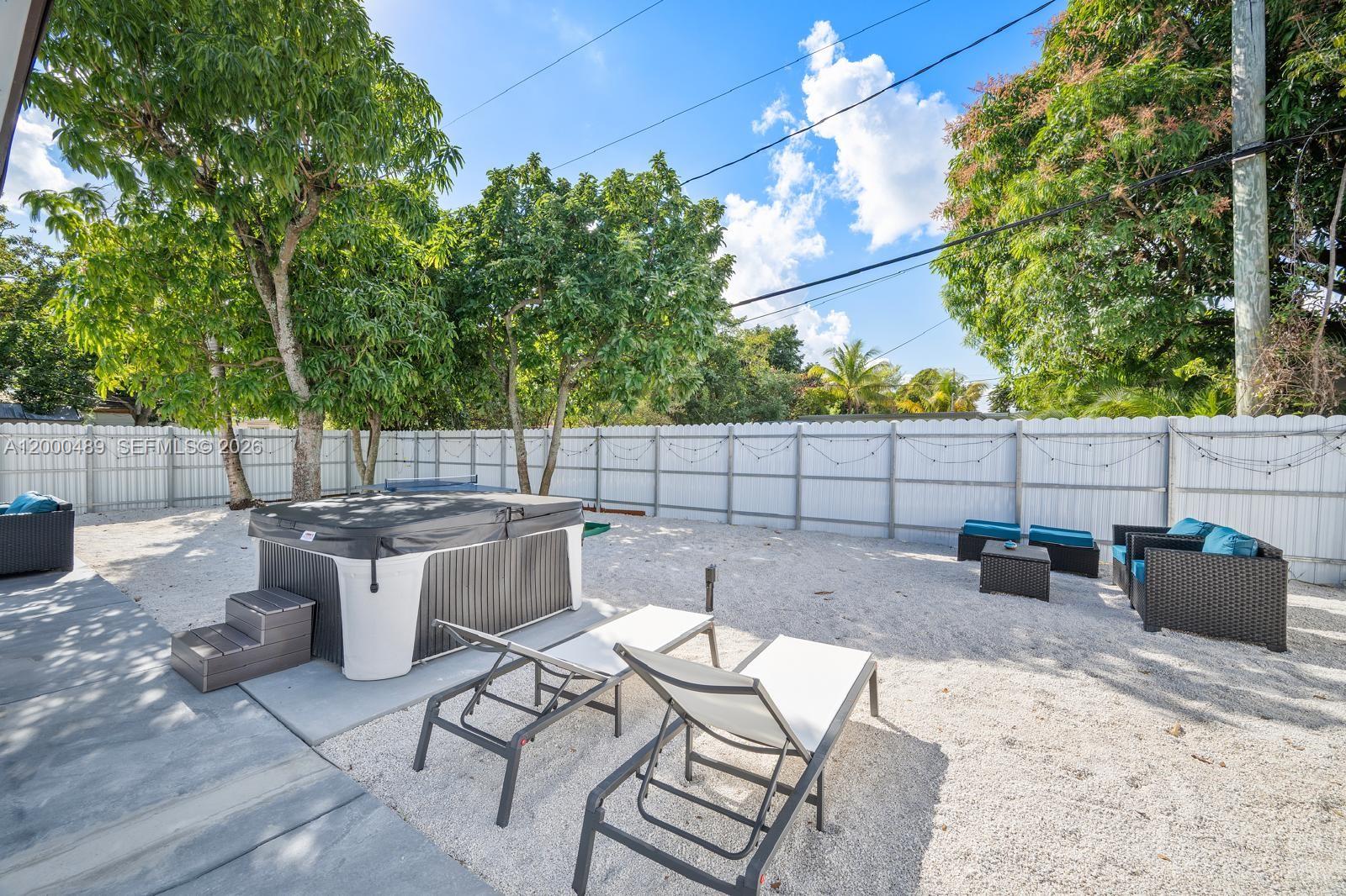 11730 Northwest 3rd Avenue Miami, FL 33168 - Photo 28 of 39 a view of backyard with seating space and trees