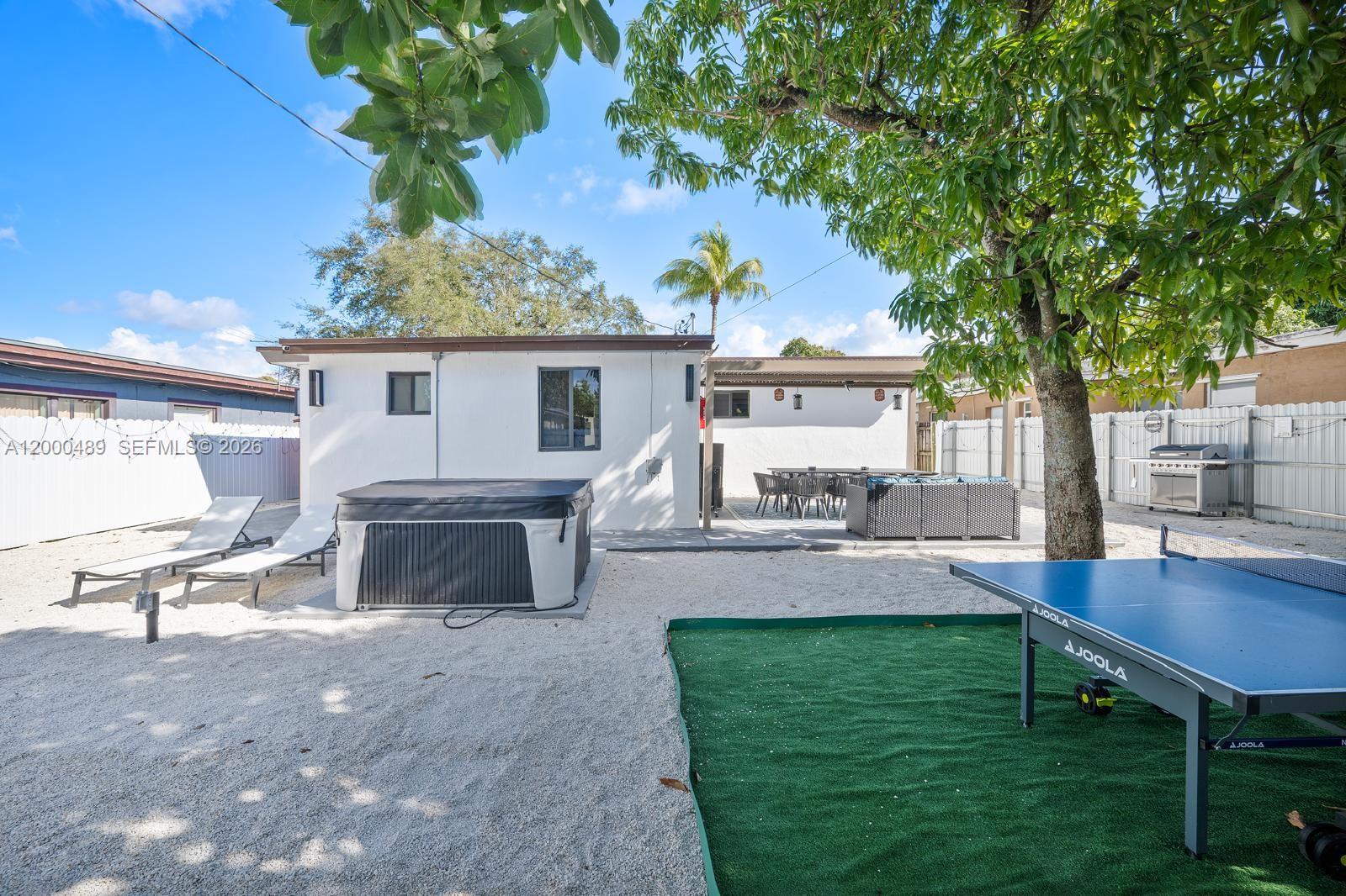 11730 Northwest 3rd Avenue Miami, FL 33168 - Photo 30 of 39 a view of a house with a yard porch and sitting area