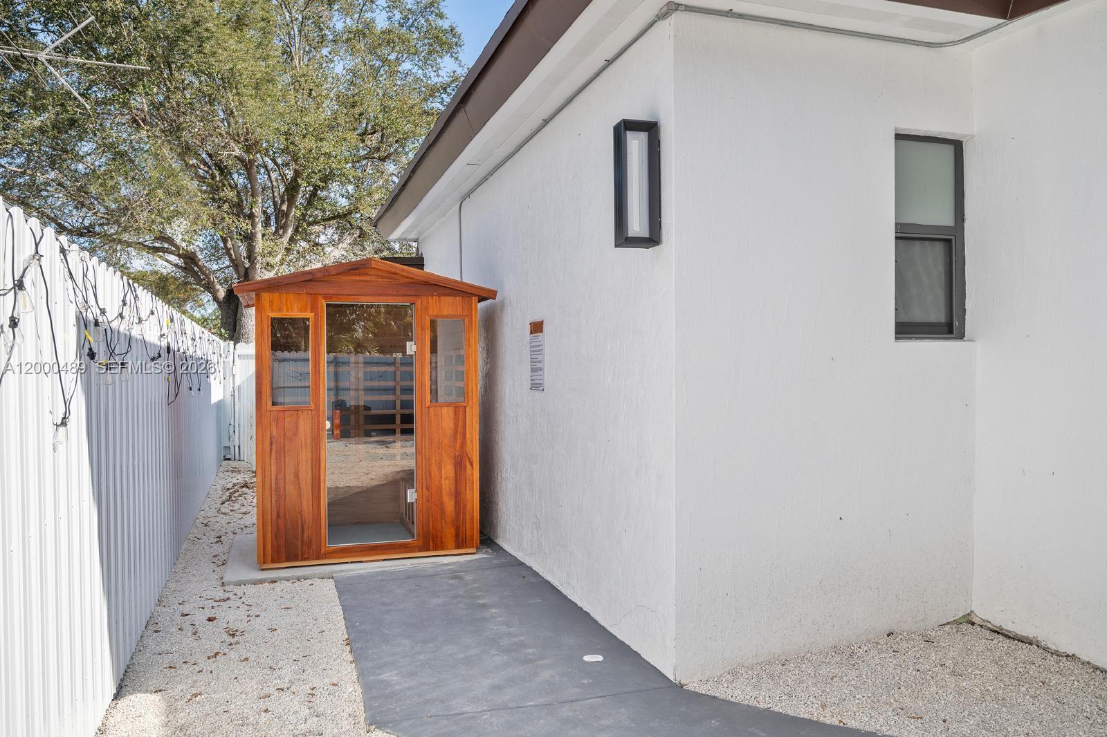 11730 Northwest 3rd Avenue Miami, FL 33168 - Photo 32 of 39 a view of a house with a porch