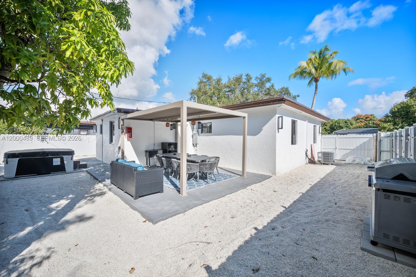 11730 Northwest 3rd Avenue Miami, FL 33168 - Photo 35 of 39 a view of a house with backyard and sitting area
