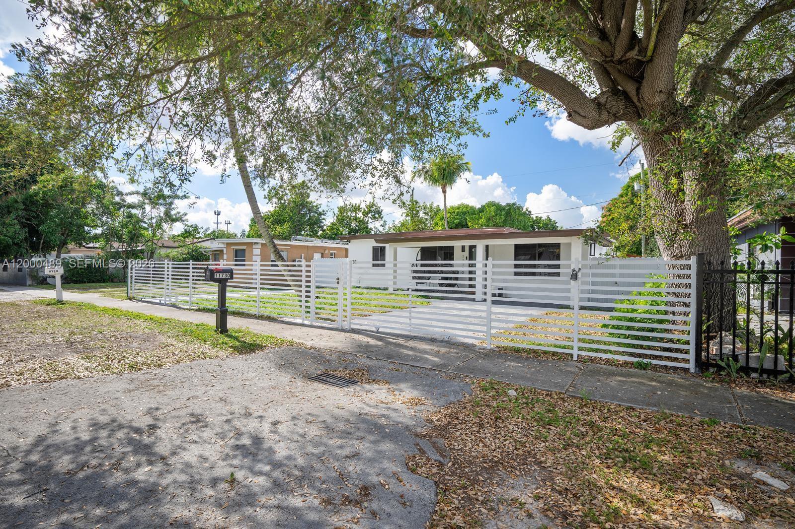 11730 Northwest 3rd Avenue Miami, FL 33168 - Photo 38 of 39 a view of a park with large trees
