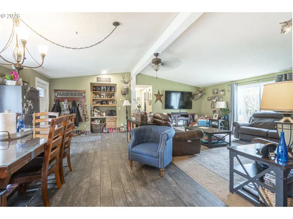 a living room with furniture or couch and a dining table