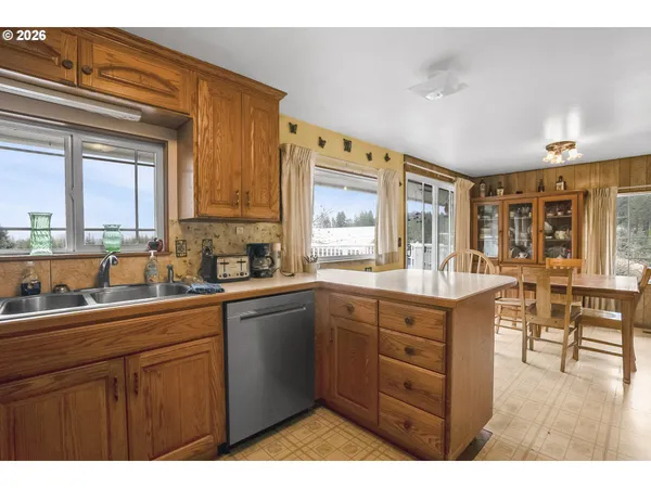 a kitchen with lots of counter top space and dining table