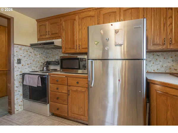 a white refrigerator freezer sitting in a kitchen