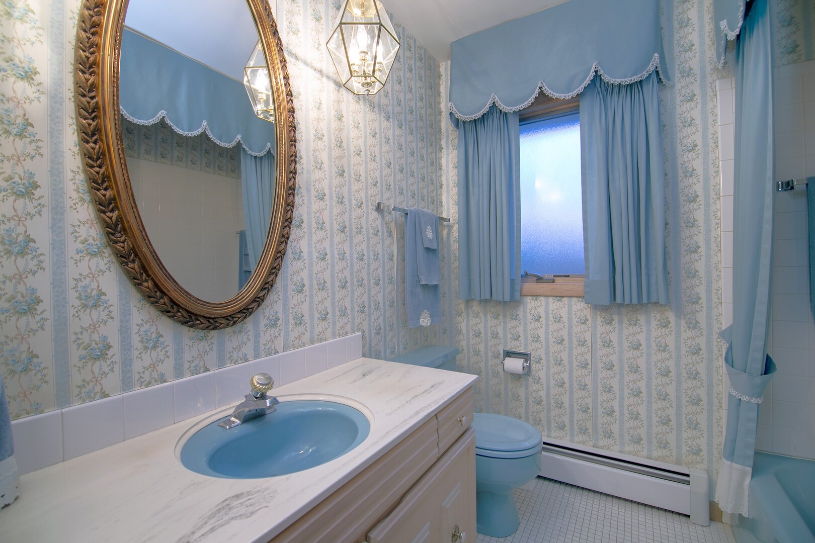 6508 Cedar Road Oak Forest, IL 60452 - Photo 14 of 27 a bathroom with a sink a toilet and mirror
