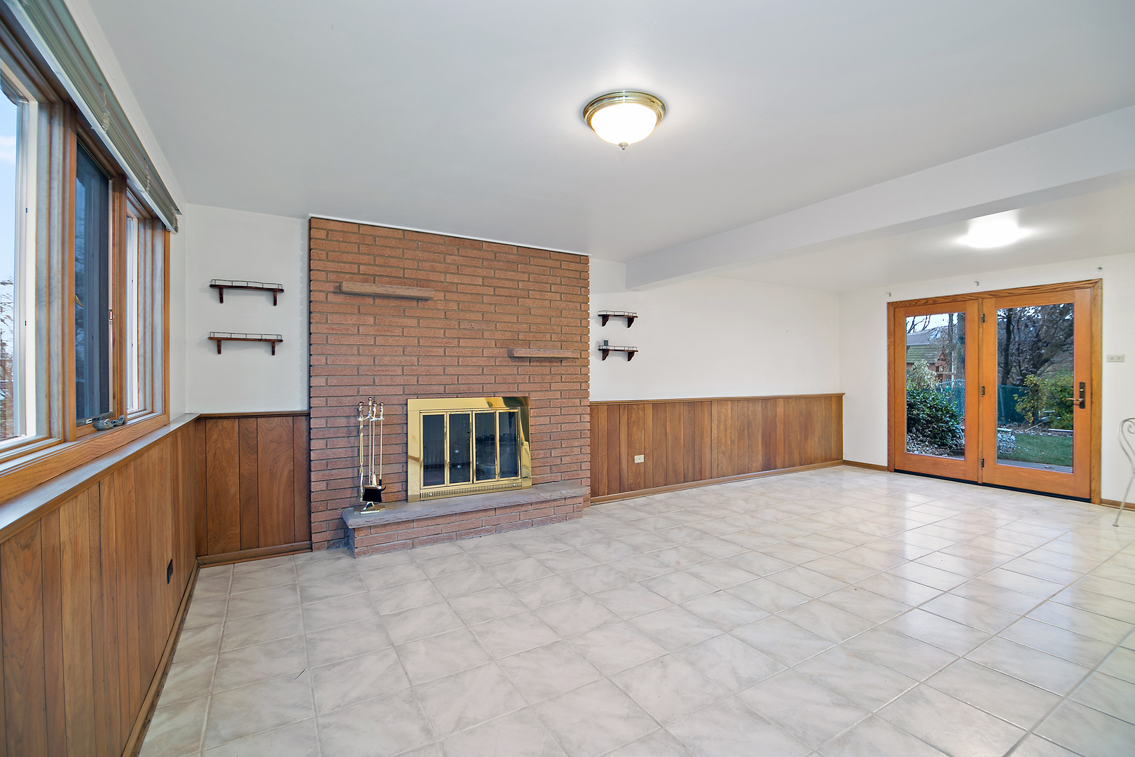 6508 Cedar Road Oak Forest, IL 60452 - Photo 16 of 27 a view of an empty room with a fireplace and a window