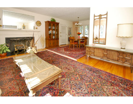 20 Mansfield Road Wellesley, MA 02481 - Photo 4 of 14 a living room with furniture a fireplace and a flat screen tv