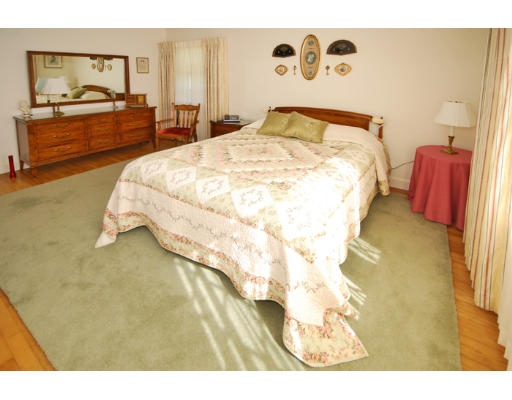 20 Mansfield Road Wellesley, MA 02481 - Photo 10 of 14 a bedroom with a bed and a painting on the wall