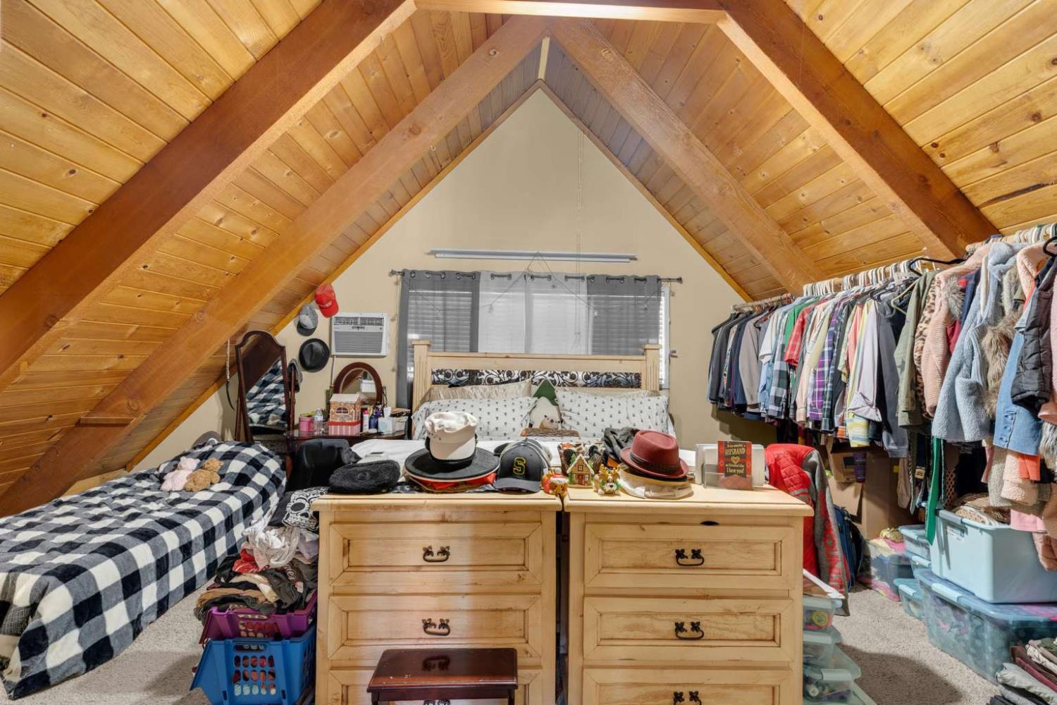 13489 Yorkshire Road Groveland, CA 95321 - Photo 21 of 35 a view of walk in closet with clothes and shoes