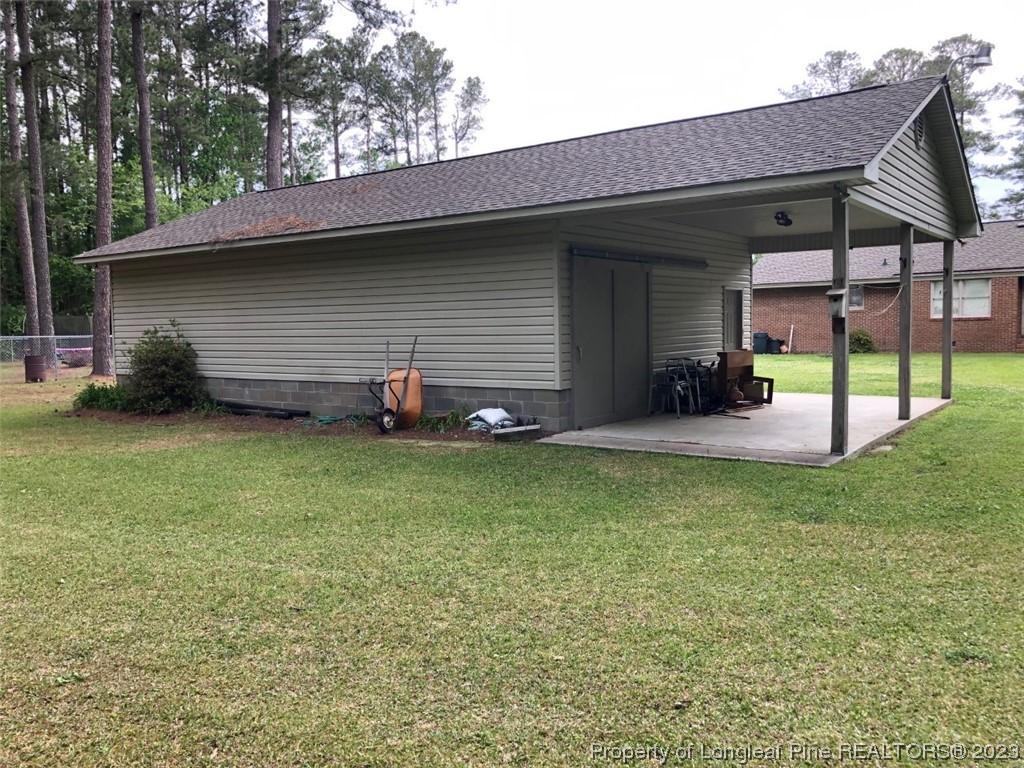 846 Bee Gee Road Lumberton, NC 28358 - Photo 11 of 42 a view of a backyard with a garden and entertaining space