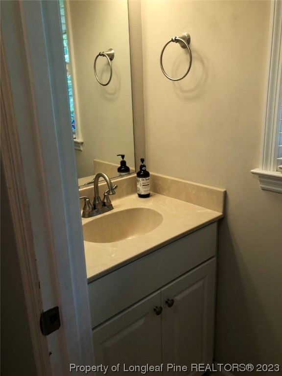846 Bee Gee Road Lumberton, NC 28358 - Photo 18 of 42 a bathroom with a sink and mirror