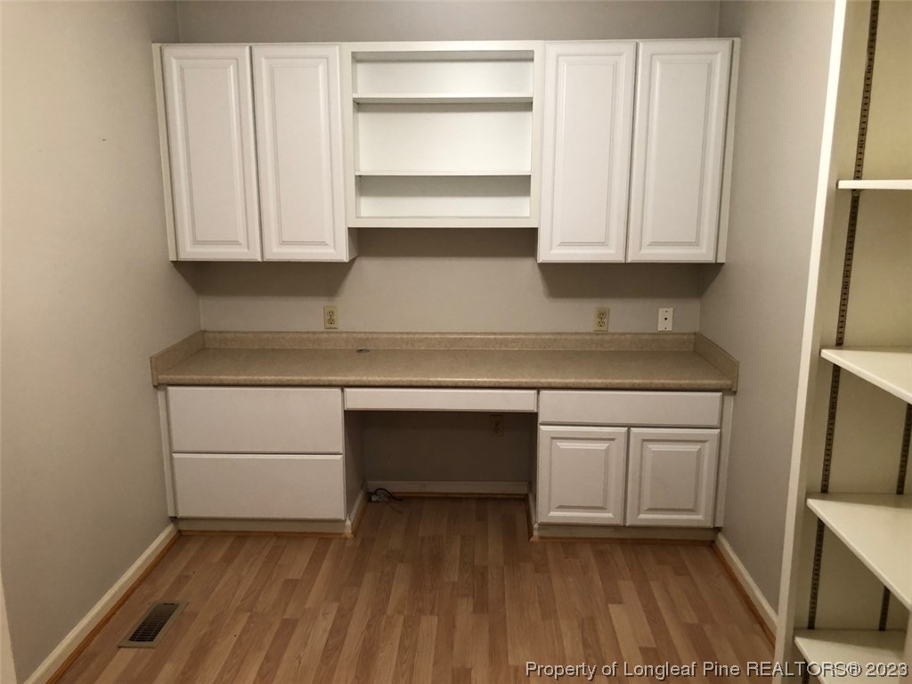 846 Bee Gee Road Lumberton, NC 28358 - Photo 20 of 42 a kitchen with granite countertop white cabinets appliances and a sink