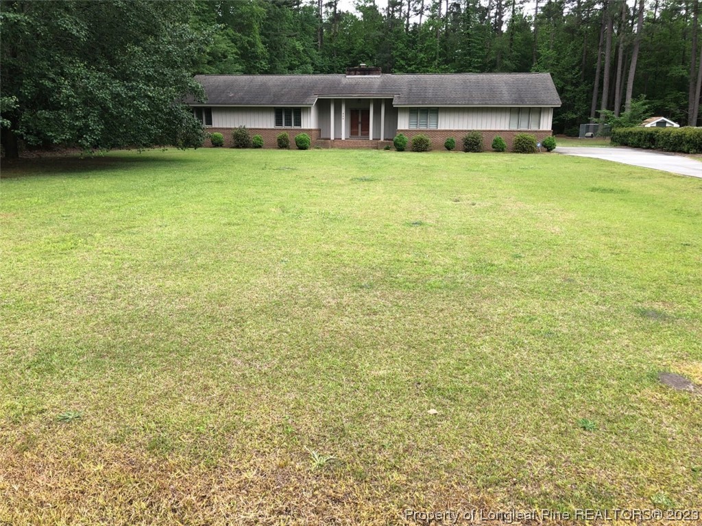 846 Bee Gee Road Lumberton, NC 28358 - Photo 2 of 42 a house with swimming pool in front of it