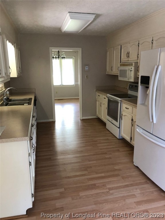 846 Bee Gee Road Lumberton, NC 28358 - Photo 21 of 42 a kitchen with granite countertop a stove a sink and a refrigerator