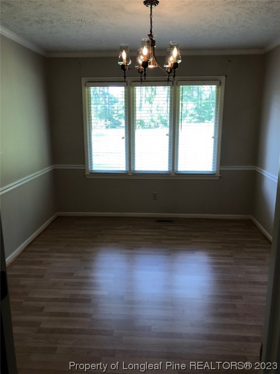 846 Bee Gee Road Lumberton, NC 28358 - Photo 23 of 42 an empty room with wooden floor and windows