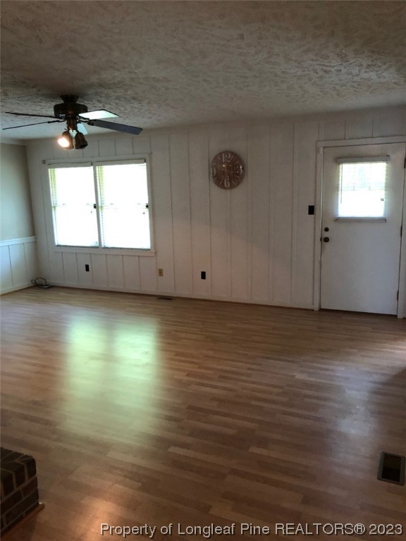 846 Bee Gee Road Lumberton, NC 28358 - Photo 24 of 42 an empty room with wooden floor and windows
