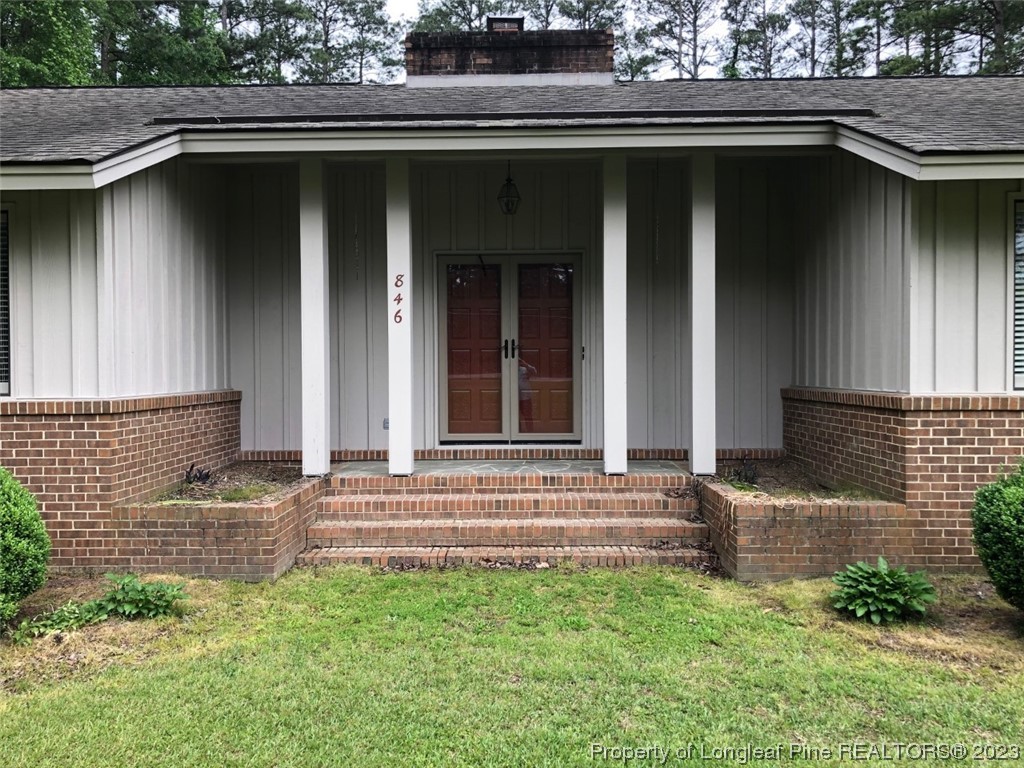 846 Bee Gee Road Lumberton, NC 28358 - Photo 3 of 42 a couple of potted plants in front of door