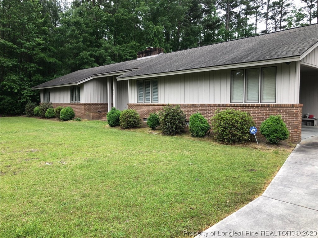 846 Bee Gee Road Lumberton, NC 28358 - Photo 4 of 42 a backyard of a house with lots of green space