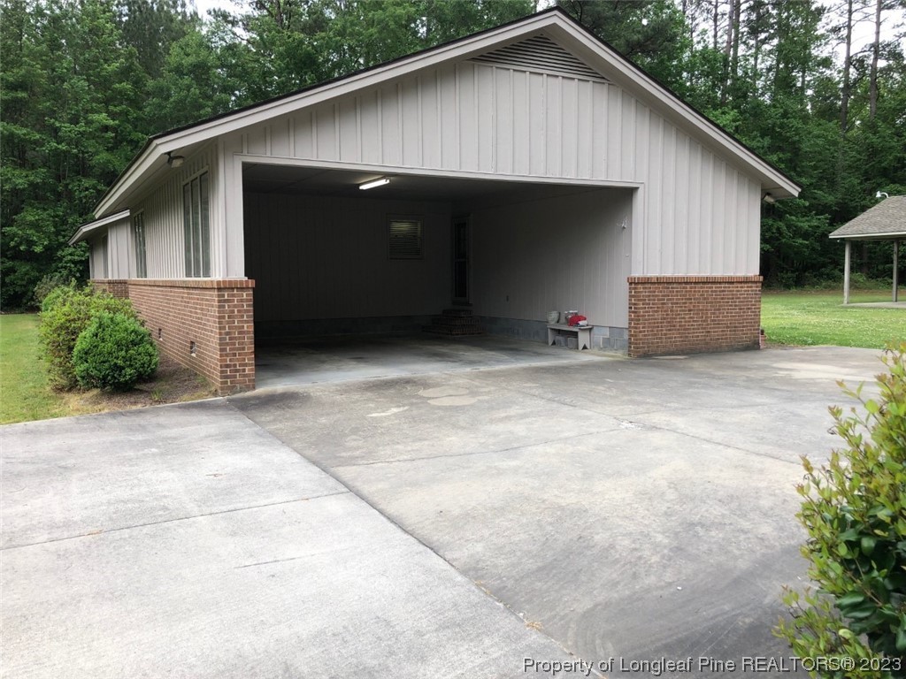846 Bee Gee Road Lumberton, NC 28358 - Photo 5 of 42 a view of a house with backyard and trees