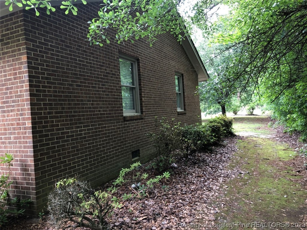 846 Bee Gee Road Lumberton, NC 28358 - Photo 6 of 42 a backyard of a house with lots of green space