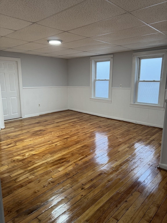 93 Webster Street, Unit 2 Fall River, MA 02723 - Photo 1 of 15 a view of an empty room with wooden floor and a window