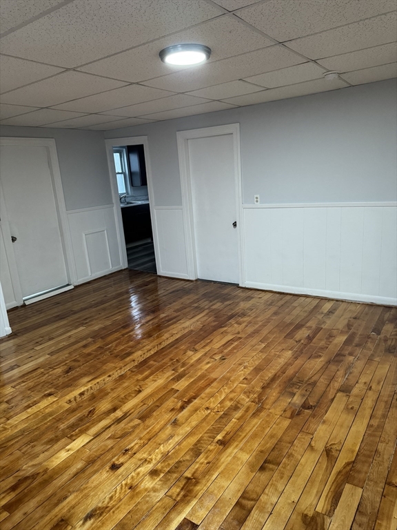 93 Webster Street, Unit 2 Fall River, MA 02723 - Photo 11 of 15 a view of empty room with wooden floor