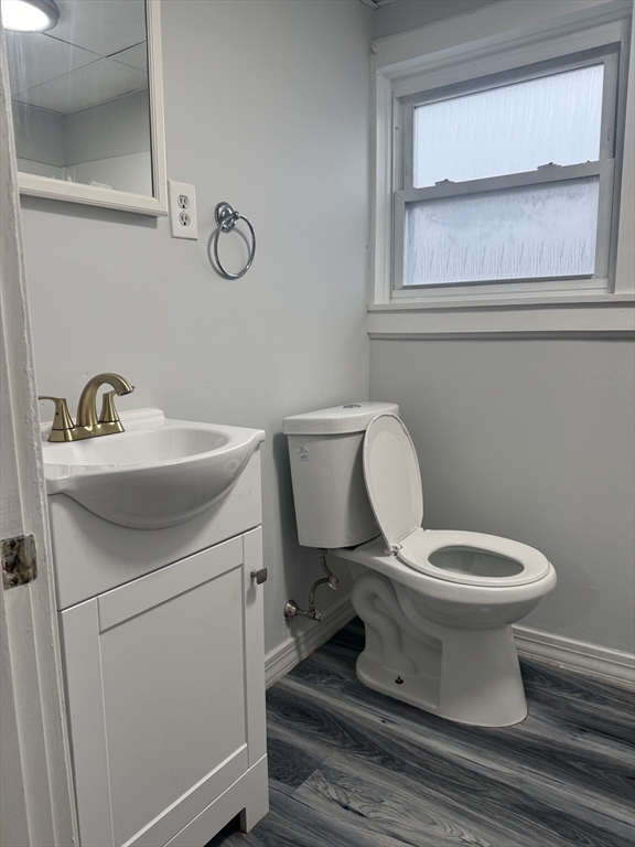 93 Webster Street, Unit 2 Fall River, MA 02723 - Photo 13 of 15 a bathroom with a toilet sink and mirror
