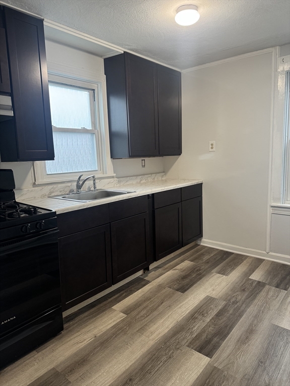 93 Webster Street, Unit 2 Fall River, MA 02723 - Photo 2 of 15 a bathroom with a sink and a mirror