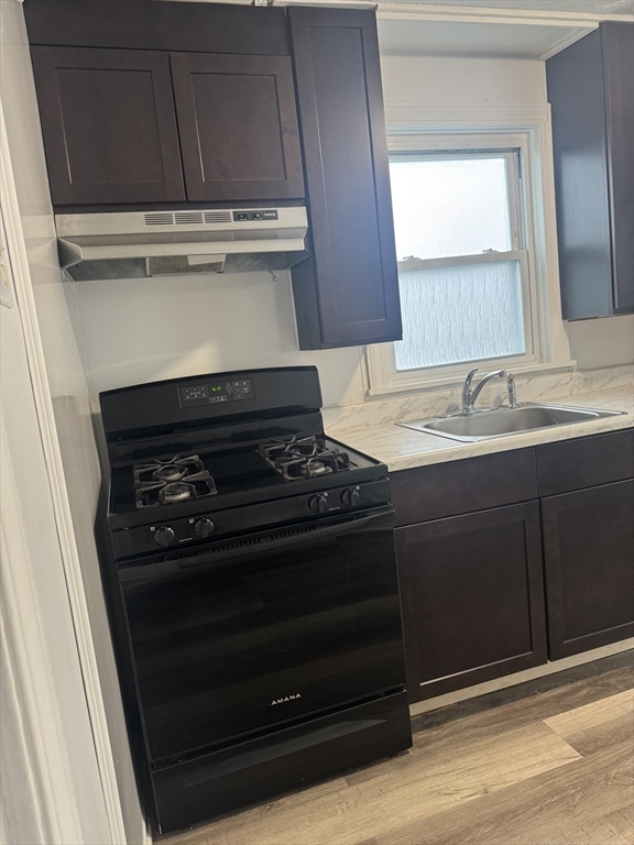 93 Webster Street, Unit 2 Fall River, MA 02723 - Photo 3 of 15 a stove top oven sitting inside of a kitchen