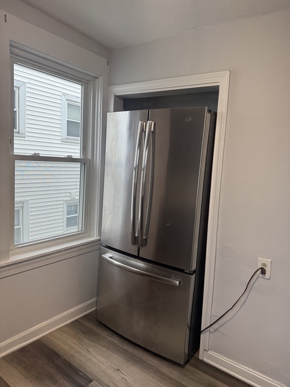 93 Webster Street, Unit 2 Fall River, MA 02723 - Photo 5 of 15 a view of empty room with wooden floor and window