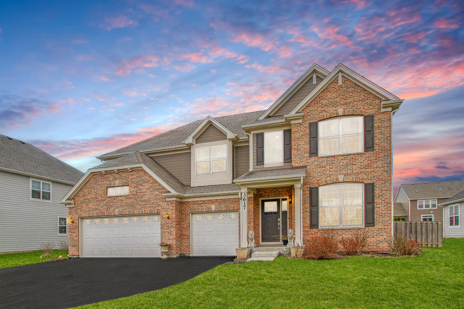 3617 Emerald Road Elgin, IL 60124 - Photo 1 of 34 a front view of a house with a yard and garage