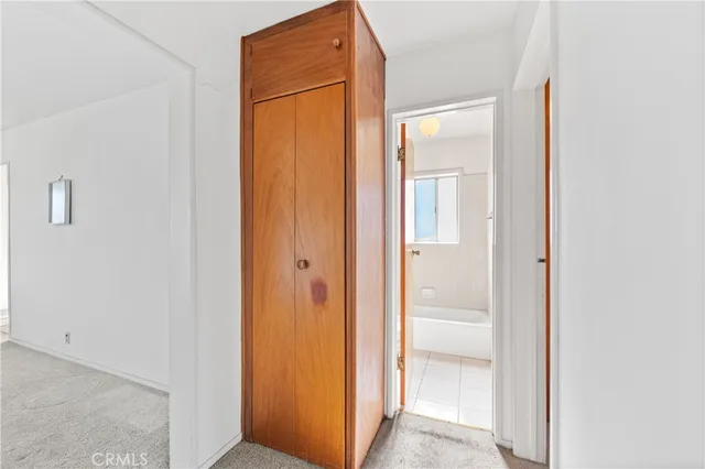 a view of a bathroom from a corridor