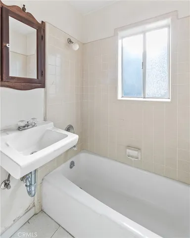 a bathroom with a sink and a bathtub