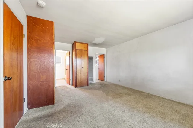 a view of a room with a hallway