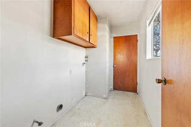 a view of a room with a window and a bathroom
