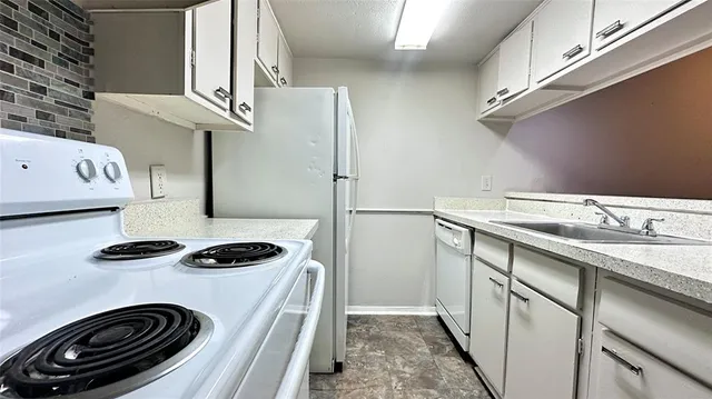 a kitchen with a cabinets and a stove