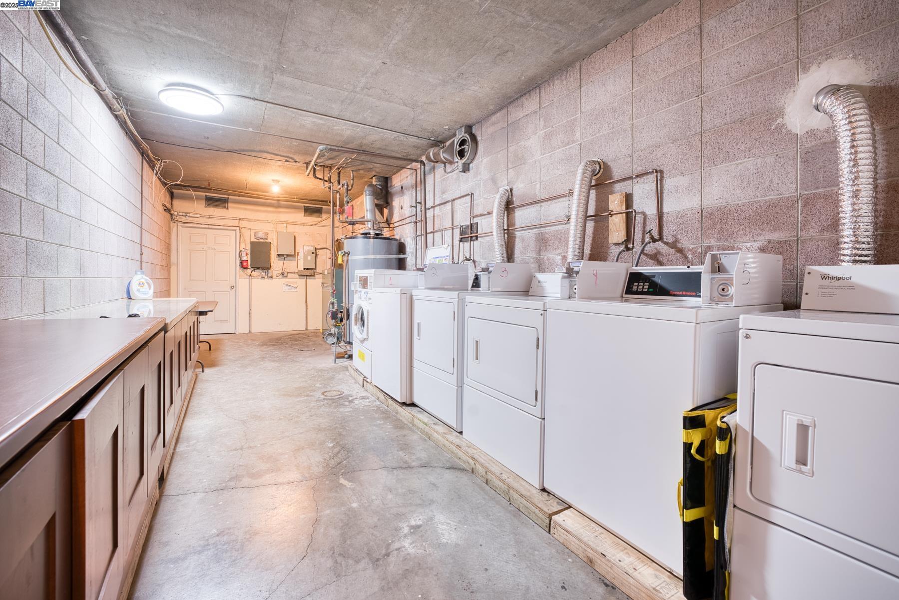 3815 Harrison Street, Unit 103 Oakland, CA 94611 - Photo 26 of 28 a utility room with cabinets