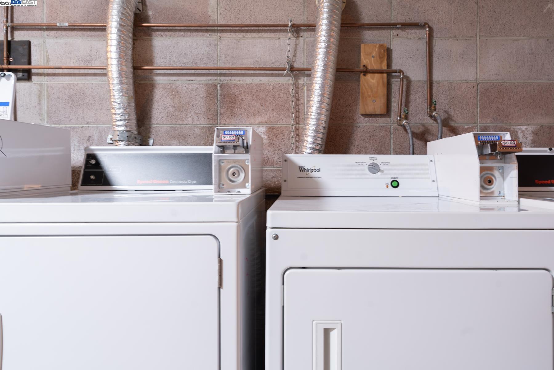 3815 Harrison Street, Unit 103 Oakland, CA 94611 - Photo 27 of 28 a utility room with dryer and washer