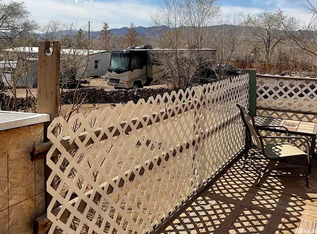 a view of a terrace with wooden fence