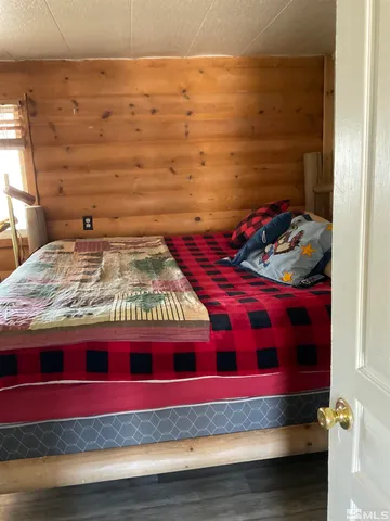 a hallway with a bed and a dresser