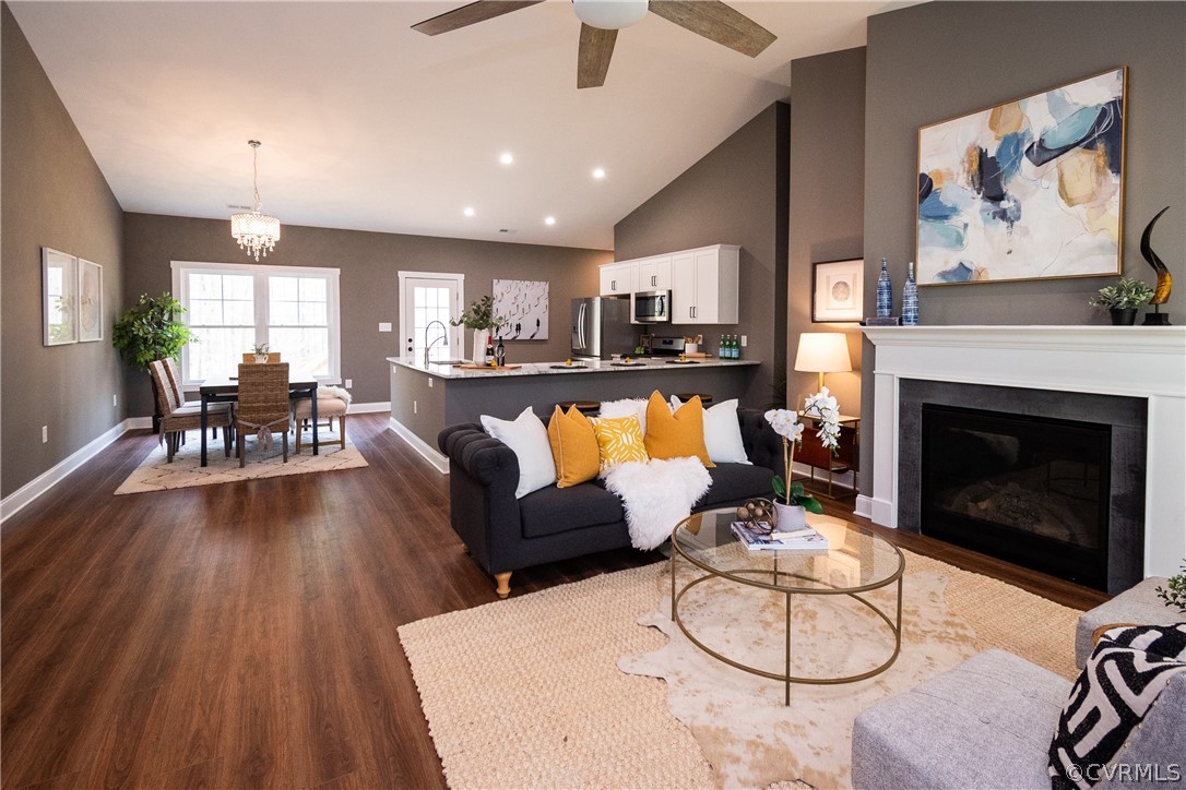 3677 Three Chopt Road Gum Spring, VA 23065 - Photo 8 of 39 a living room with furniture a fireplace and a flat screen tv